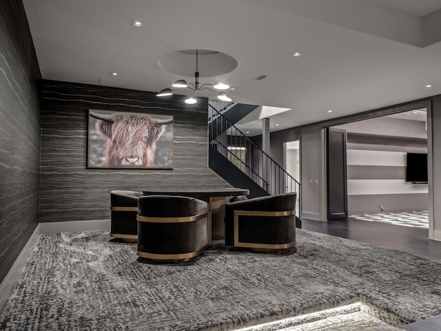 interior space featuring a chandelier and tile walls