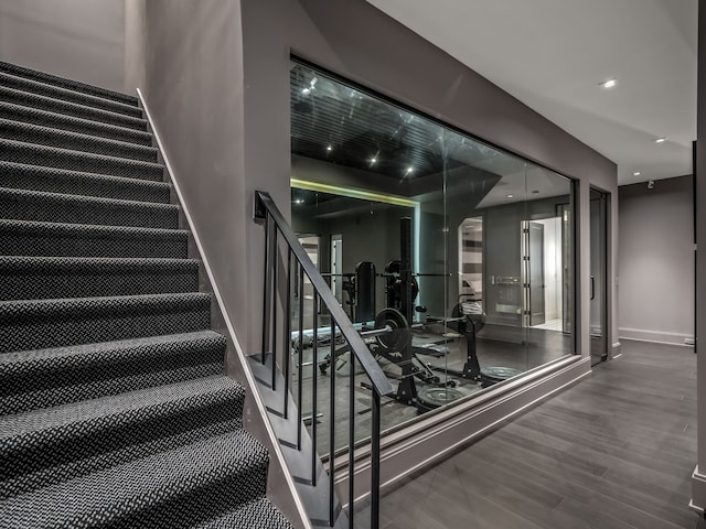 stairs with wood-type flooring