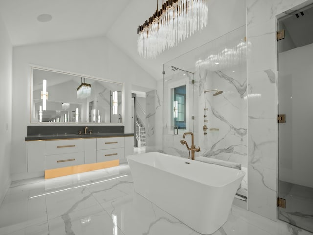 bathroom featuring a tub, tile walls, vanity, and vaulted ceiling