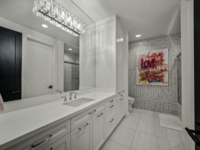 bathroom featuring vanity, tile patterned floors, toilet, tile walls, and an enclosed shower