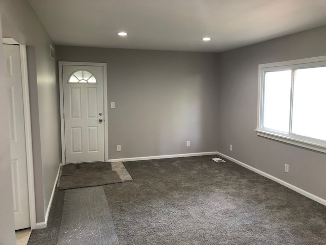 view of carpeted entrance foyer