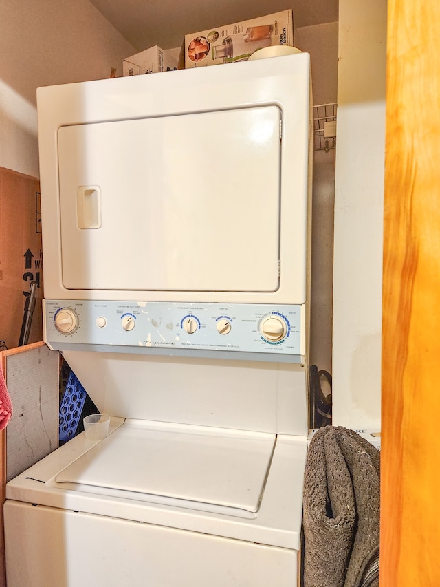 washroom with stacked washer and dryer