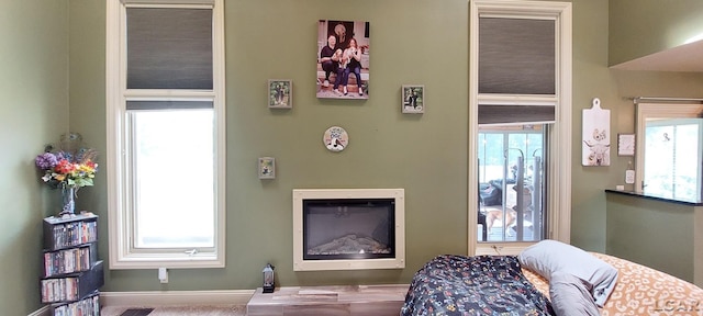 carpeted living room featuring a healthy amount of sunlight