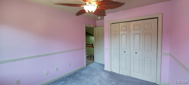 unfurnished bedroom with carpet flooring, ceiling fan, and a closet