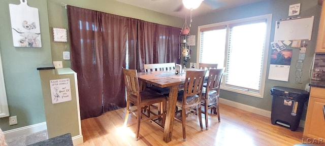 dining area featuring light hardwood / wood-style flooring, plenty of natural light, and ceiling fan