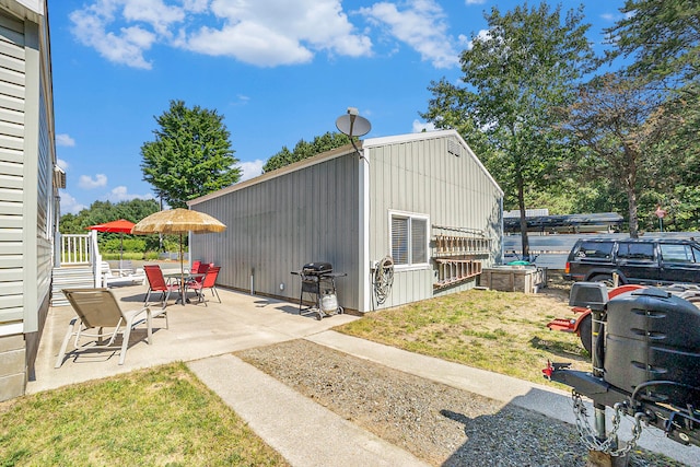 view of outbuilding featuring a yard