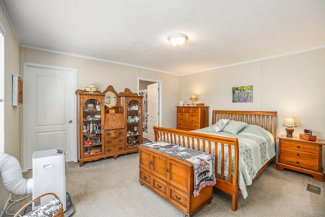 carpeted bedroom featuring a textured ceiling and crown molding