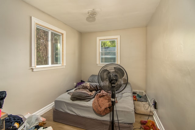 bedroom with hardwood / wood-style floors