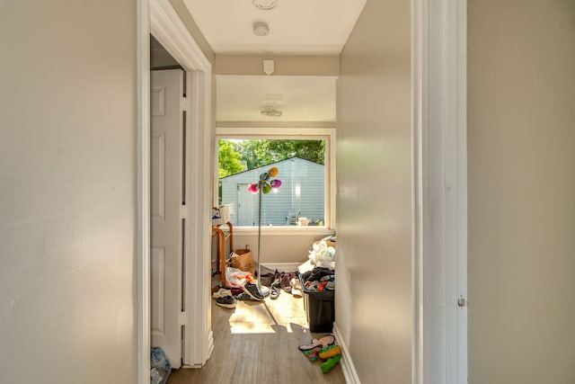 hallway with hardwood / wood-style floors