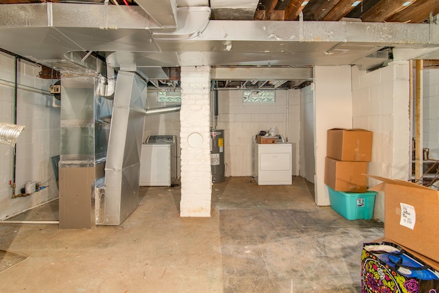 basement with washer / dryer, electric water heater, and heating unit