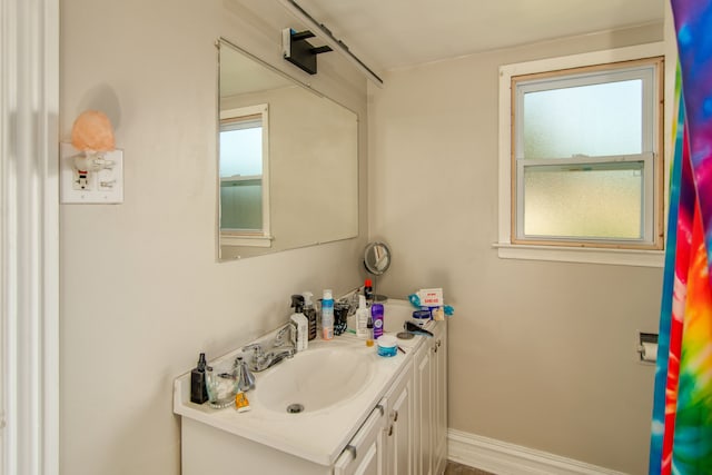 bathroom featuring vanity and a healthy amount of sunlight