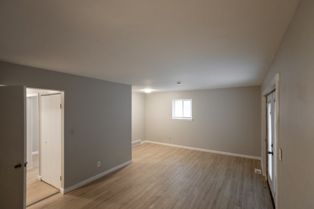 empty room with light wood-type flooring