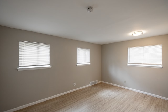 spare room featuring light wood-type flooring