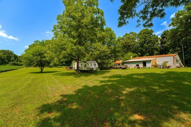 23381 Fosdick St, Dowagiac, MI 49047 - view of grassy yard featuring an outbuilding