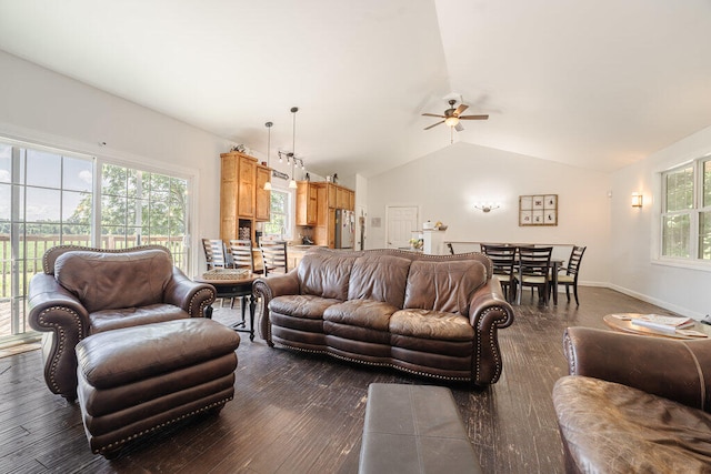 living room with ceiling fan, lofted ceiling, and dark wood-type flooring