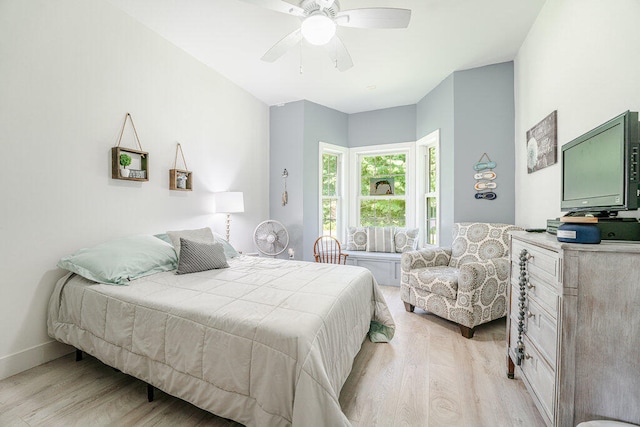 bedroom with light hardwood / wood-style floors and ceiling fan