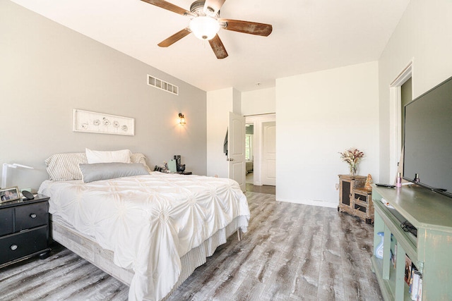 bedroom with ceiling fan and light hardwood / wood-style flooring