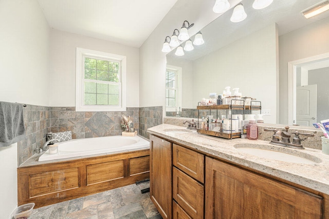 bathroom with a bathtub and vanity