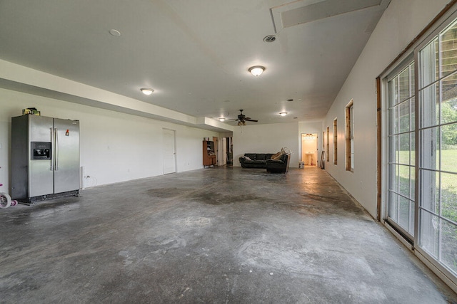 garage with stainless steel fridge with ice dispenser and ceiling fan