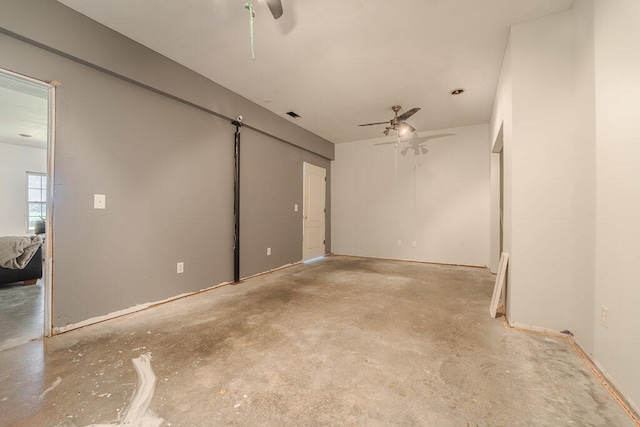 interior space with ceiling fan