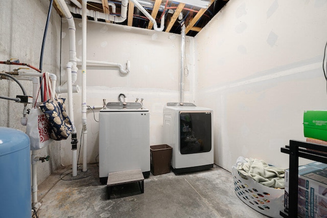 clothes washing area featuring independent washer and dryer