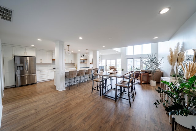 dining area featuring dark hardwood / wood-style flooring and sink