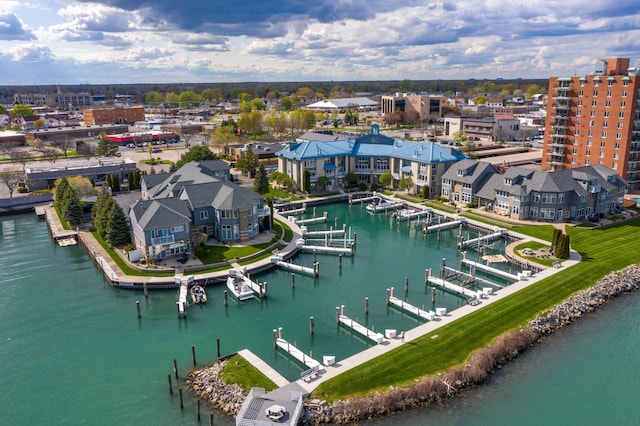 birds eye view of property with a water view