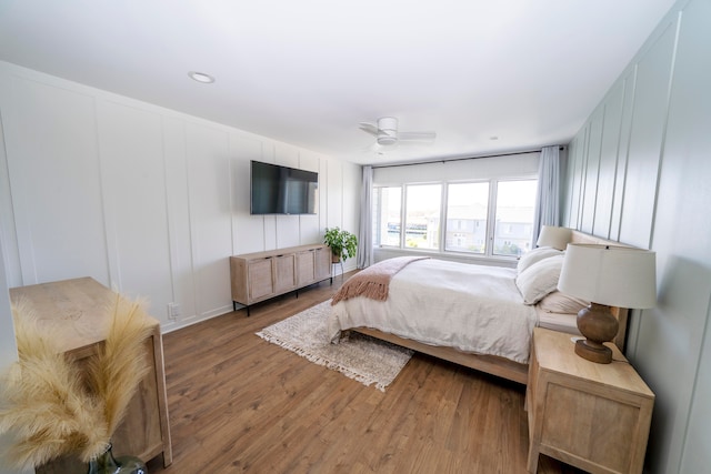 bedroom with hardwood / wood-style flooring and ceiling fan