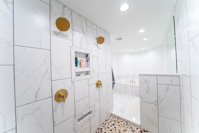 bathroom with a tile shower