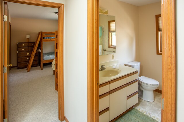 half bathroom featuring toilet and vanity