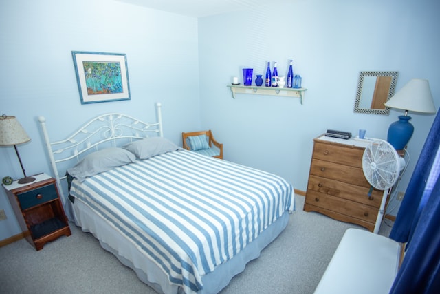 bedroom featuring baseboards and carpet flooring