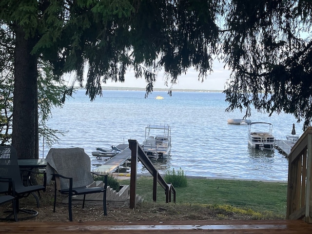 dock area with a water view