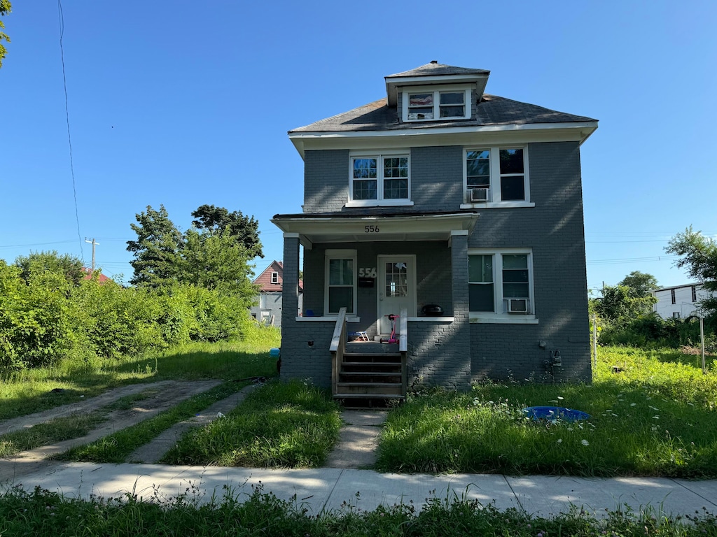 view of front of house featuring cooling unit