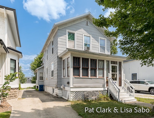 view of front of home featuring a sunroom