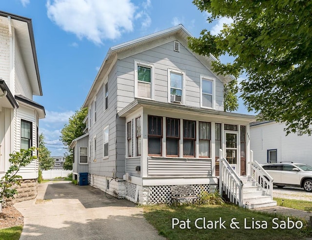 227 Elliot Ave, Grand Haven, MI 49417 - view of front of home featuring a sunroom and cooling unit
