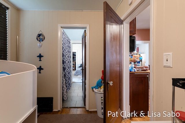 hall with dark wood-type flooring