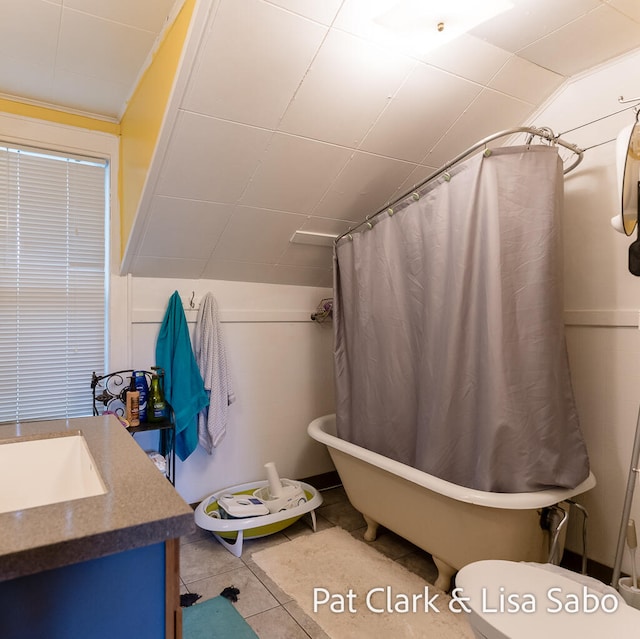 full bathroom with tile patterned flooring, vanity, toilet, and independent shower and bath