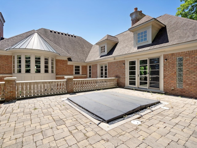 back of house featuring a patio