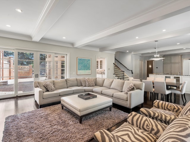 living room featuring beam ceiling, crown molding, french doors, and hardwood / wood-style flooring