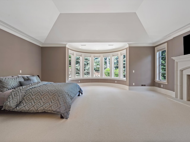 bedroom featuring carpet floors, vaulted ceiling, and crown molding