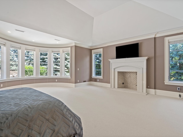 bedroom with carpet flooring, crown molding, and multiple windows