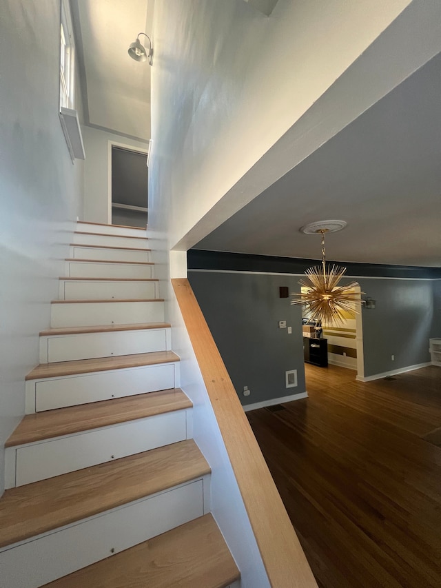 stairs with hardwood / wood-style floors