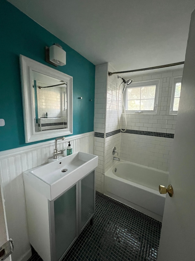 bathroom featuring tiled shower / bath combo and tile patterned floors