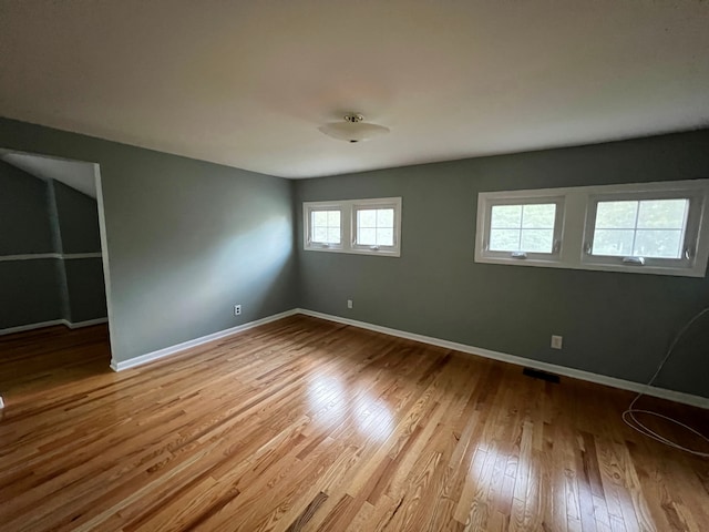 spare room featuring light hardwood / wood-style flooring