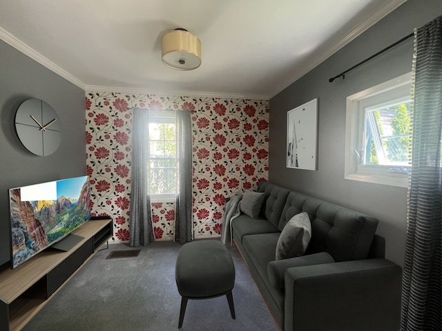 living room with crown molding, carpet, and a wealth of natural light