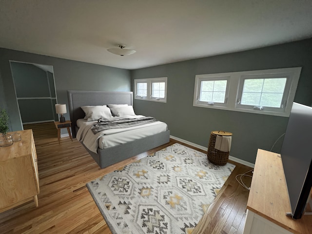 bedroom with hardwood / wood-style flooring