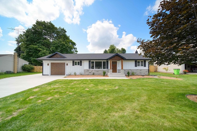 ranch-style home with a garage and a front lawn