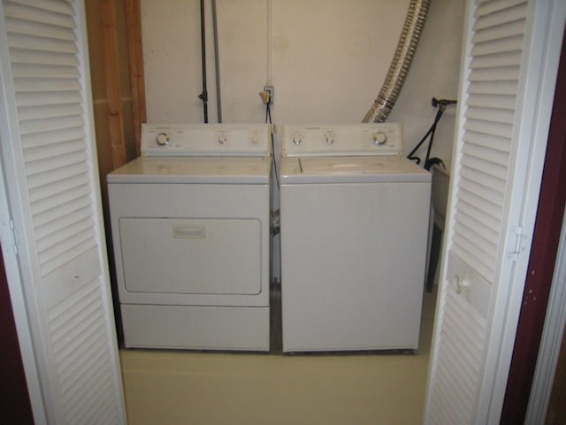 laundry area with washing machine and clothes dryer