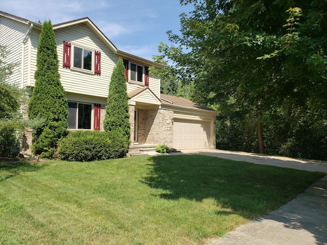 view of front of property featuring a garage and a front lawn