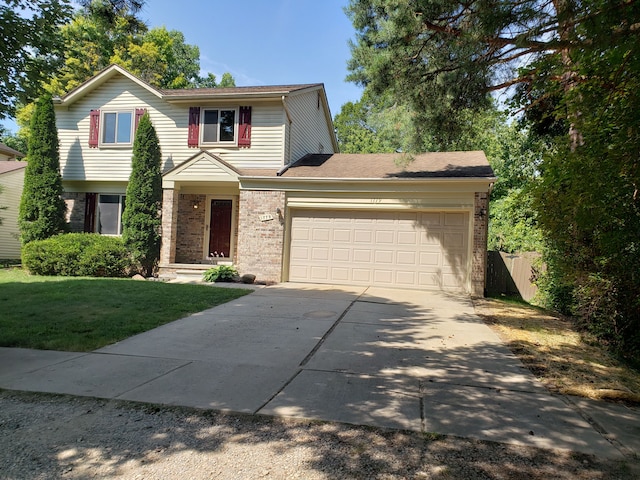 front of property with a garage and a front yard